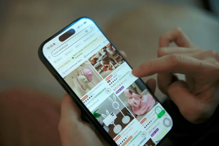 Person scrolling through an online shop on a phone